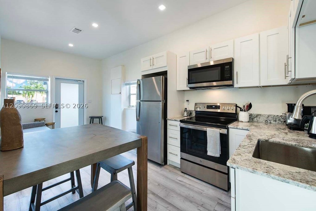 Photo of 115 SE 2nd St #2, Hallandale Beach, FL 33009 (MLS # A12090869)