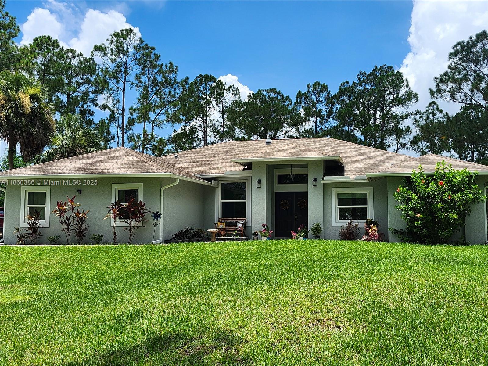 This BEAUTIFUL, FULLY FURNISHED 3 bedroom(+den), 2 bathroom home with a 2 car garage and a lanai overlooking the over 2 1/2 acres of land is just what the doctor ordered! It even has hurricane impact windows throughout! This home is located in a quiet area of Naples and is perfect for anyone looking to relocate to the Naples area or simply get away from the hustle and bustle of city life, but still close enough to shopping, restaurants, etc... Just bring your suitcases and toothbrushes because all you need is already waiting for you in this home!