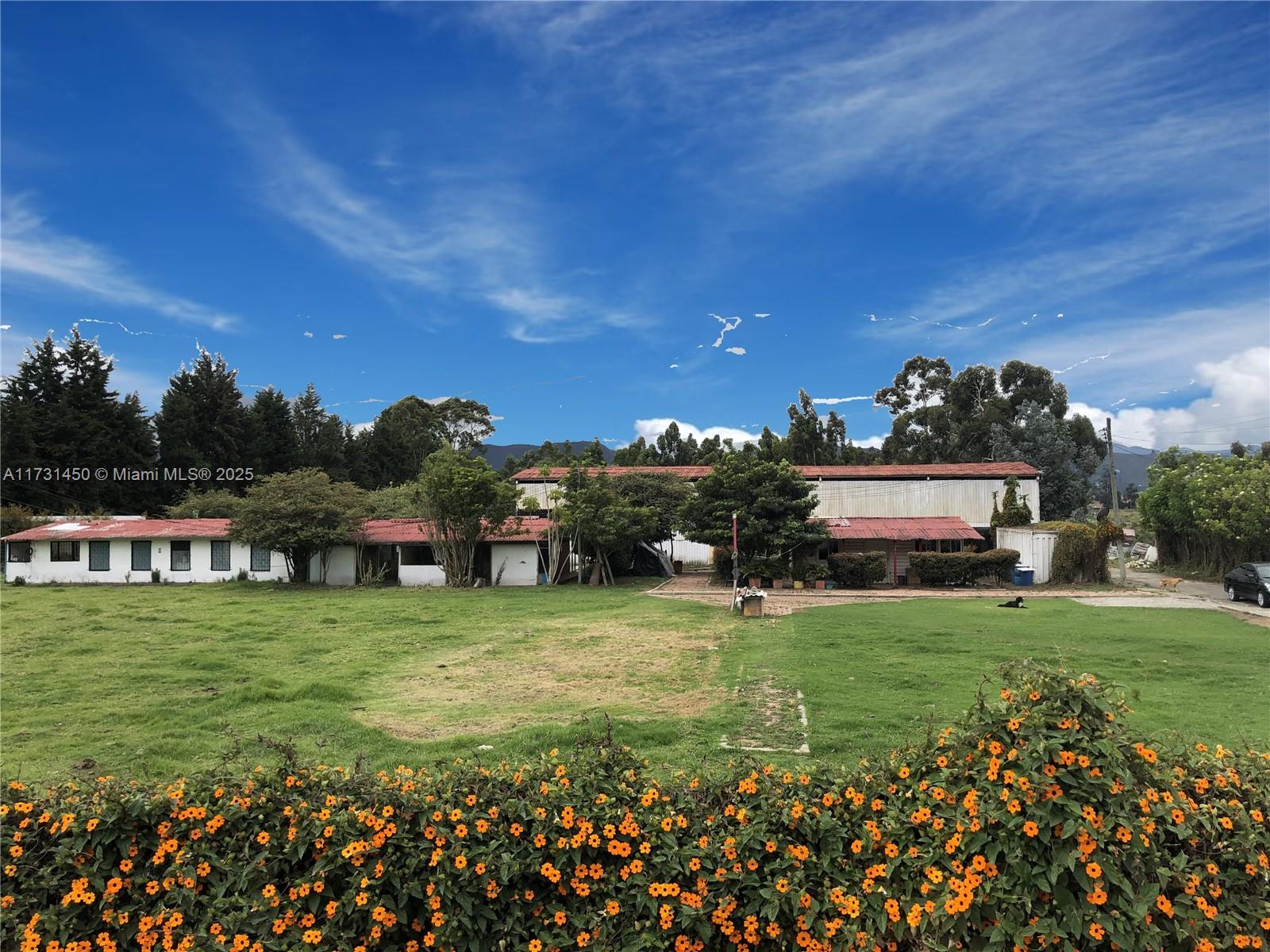 Great opportunity to own prime property in highly desired sought after area! 18,000 M2 (193,750 SqFt / 4.44 Acres / 1.8 Hectares) on KM20 Autopista del Norte Bogota-Chia, Colombia, next to the Mobil El Rodeo, La Caro-Chia. Great exposure. 90 Meters (295 Ft) Frontage Autopista del Norte & 65 Meters (213 Ft) frontage Rio Bogota. Great opportunity to own property on the Autopista del Norte in one of the fastest growing areas. Six office buildings & spacious warehouse with total area of 1,000 M2 (10,763 Sq.Ft). Great for company headquarters, Construction & Oil Companies, Retail space or a school/University with lots of land for parking and storage, or to develop & build to your needs. Near the Universidad de la Sabana, Centro Chia, Hipodromo (Racetrack) & Urbanizacion San Jacinto.