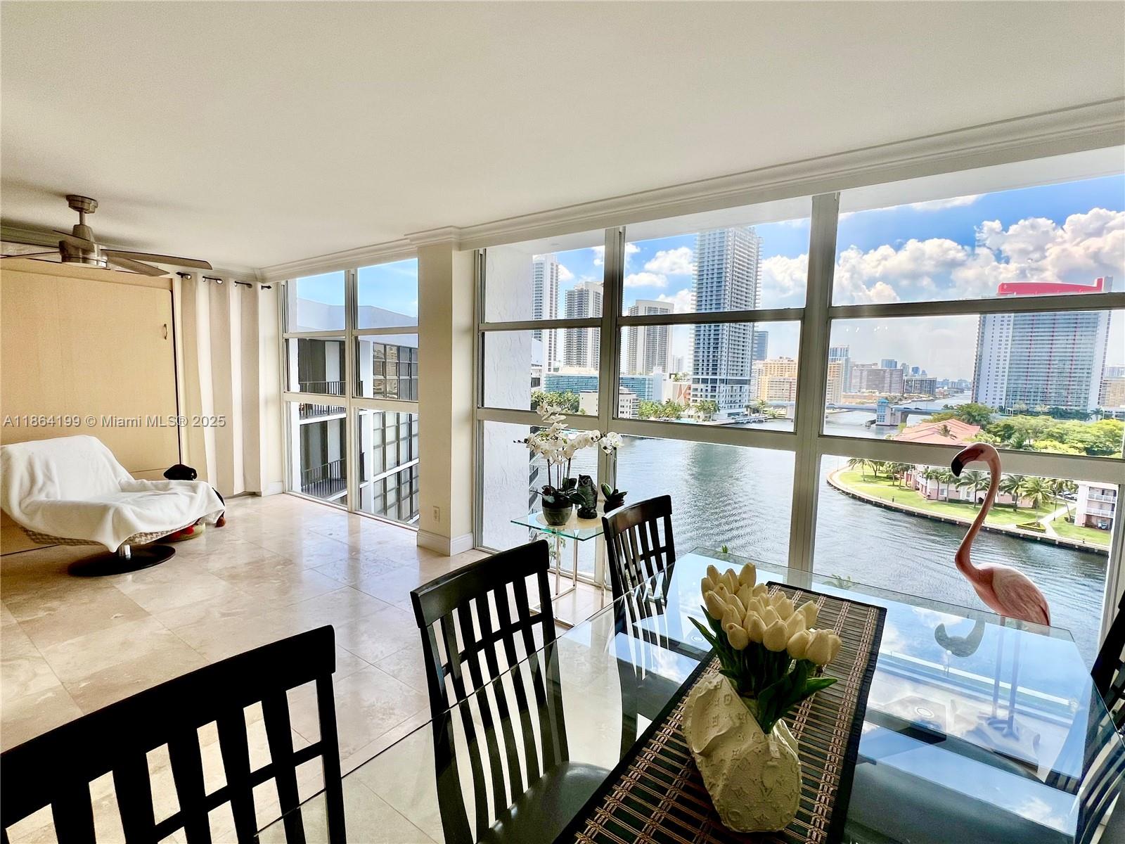 EXPERIENCE BREATHTAKING PANORAMIC VIEWS OF THE INTRACOASTAL WATERWAY, BAY, AND CITY SKYLINE FROM THIS BEAUTIFULLY UPDATED, MOVE-IN READY RESIDENCE. THIS SPACIOUS UNIT FEATURES FLOOR-TO-CEILING WINDOWS IN BOTH THE LIVING AREA AND BEDROOM, ALLOWING FOR AN ABUNDANCE OF NATURAL LIGHT AND STUNNING VISTAS. THE THOUGHTFULLY DESIGNED FLOOR PLAN INCLUDES ONE BEDROOM, A VERSATILE DEN, AND TWO FULL BATHROOMS. ELEGANT MARBLE FLOORING FLOWS THROUGHOUT, COMPLEMENTED BY A FULLY RENOVATED KITCHEN WITH MODERN CABINETRY AND PREMIUM STAINLESS STEEL APPLIANCES. LOCATED IN A FULL-SERVICE, PET-FRIENDLY BUILDING OFFERING 24-HOUR SECURITY, VALET SERVICE, AND AN ARRAY OF RESORT-STYLE AMENITIES—HEATED POOL, FITNESS CENTER, SAUNA AND MORE.IDEALLY SITUATED JUST MINUTES FROM THE BEACH.