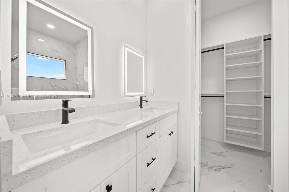 Welcome to newly built home in the growing Lehigh Acres community. This spacious property offers 1699 square feet, with 3 bedrooms and 2 full bathrooms, perfect for a family ready to begin their next journey. Enjoy a bright and open layout with impact-resistant windows and doors, a modern kitchen, pendant lighting. The kitchen seamlessly integrates with the main living area, making it ideal for entertaining. The property also includes a well water system and is located in a quiet, rapidly developing neighborhood in Lehigh Acres, an ideal location for your new home. Don't miss this opportunity to own a stunning move-in ready home in one of Southwest Florida's growing areas!