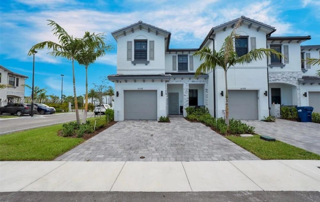 Welcome Home to this Stunning New Construction Townhouse situated in the vibrant city of Miami Gardens! This Wonderful 1600 SqFT residence features 3 large bedrooms, 2.5 bathrooms, a 1 car garage, and room for 2 more cars on its brick paved driveway. While Offering top-notch Features that include an Open floor-plan kitchen with granite countertops, soft close shaker cabinets, Tile flooring, zebra window blinds, built-in Smart Home System, and stainless steel appliances still under warranty. This corner lot model has an ideal backyard for hosting family and friends, surrounded by a privacy fence. This gated community provides resort-style amenities such as a fitness center, pool, and clubhouse .