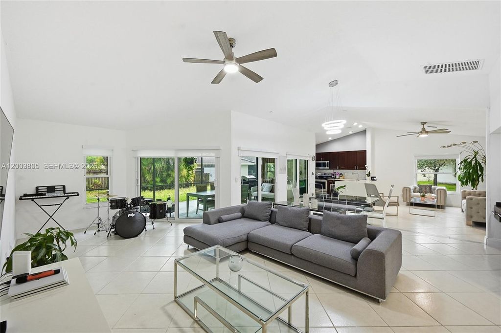 Photo of 5036 NW 66th Ln, Coral Springs, FL 33067 (MLS # A12003805)