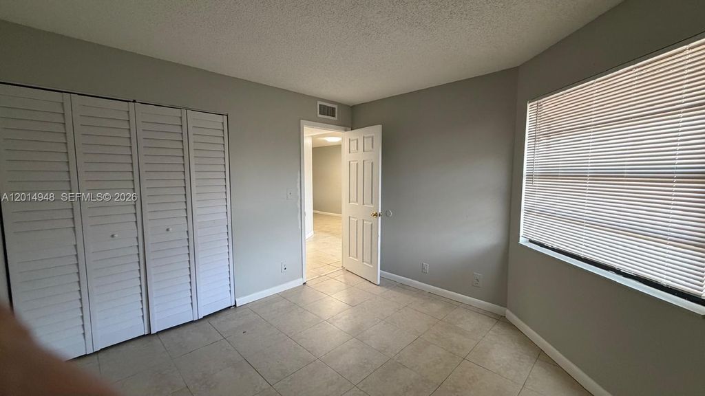 Photo of 4010 Lakeside Drive #4010, Tamarac, FL 33319 (MLS # A12014948)