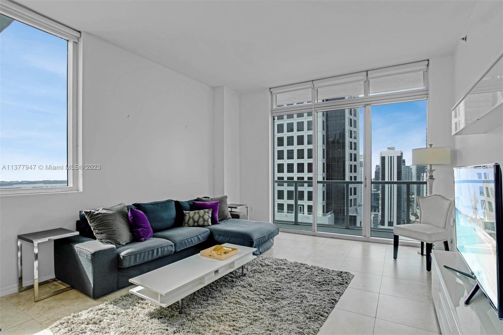 Beautiful centrally located furniture 2 bedroom 2 bath in the heart of Brickell. The unit features a split floor plan tiled floors, an open concept kitchen with a spacious living room and formal dining area. Large balcony with access from the living Room and master bedroom. Walk-in closet with custom built-in cabinetry in both rooms, and brand new front loaded washer and dryer in the unit. The unit is one block from the metro mover and Brickell City Center with easy access to all shops, bars, and restaurants. Amazing views of the city ,waterways and blue skies. Easy to show!