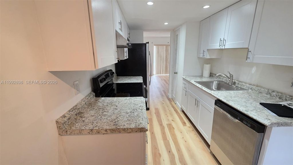 Photo of 650 Tennis Club Dr #308, Fort Lauderdale, FL 33311 (MLS # A11992898)