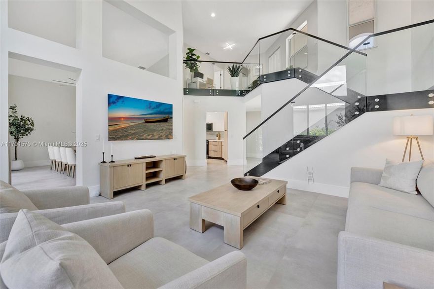 Experience luxury at its finest in this stunningly renovated 3-bed, 2-bath corner-lot home in the exclusive gated community of Costa Brava at Boca Pointe. Bathed in natural light, this residence features soaring ceilings, a dramatic glass staircase, & a sleek, open-concept layout. The designer chef’s kitchen is a true showstopper with quartz countertops, matte black stainless appliances, & custom cabinetry. The elegant primary suite is conveniently located on the main level. Outfitted with high-end materials and quality furnishings, plus impact windows, a new roof, new AC, new water heater, and a 2-car garage. Enjoy quiet water views from the screened patio. No mandatory membership & zoned for top-rated schools. Wow! Also, the Furniture could be sold separately (negotiable), Don't wait!