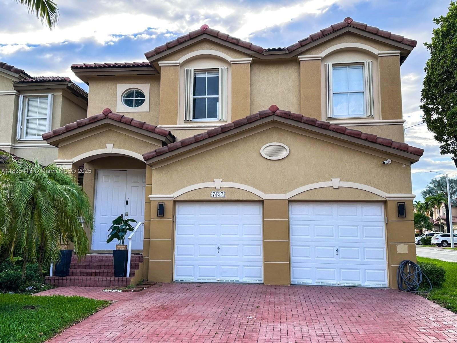 Experience lakeside living in this elegant contemporary townhouse in the prestigious gated community of Doral Isles. This smart home features 4 spacious bedrooms, 2.5 bathrooms, marble floors, soaring ceilings, and a modern open kitchen with granite countertops and center island. Enjoy peaceful lake views from your private patio. Additional highlights include a 2-car garage, in-unit laundry, accordion shutters, and a fire alarm system. Home also includes a custom wall unit and a 75” Smart TV. Resort-style amenities include clubhouse, pools, tennis courts, gym, and playgrounds. Low HOA of $324/month covers security, landscaping, and exterior maintenance. Zoned for top-rated schools and close to shopping, dining, and major highways.