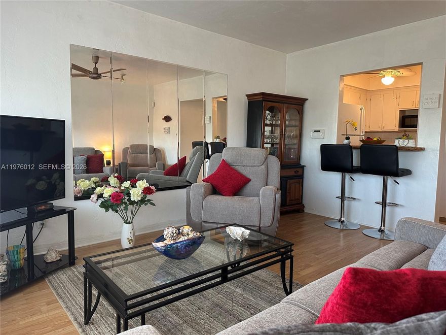 This Beautifully decorated and furnished, move in ready apartment is located in the heart of Hallandale Beach close to the Aventura Mall shopping, the Big Easy Casino, Gulf Stream Park racing, many fabulous restaurants and much more. The Interior includes new living room furniture with a large TV, a fully stocked Kitchen and large Bedroom complete a Queen size bed, a dresser, a chest and 2 spacious closets. The bathroom has a tub shower combo and an updated vanity. Two new AC units and a new hot water tank complete the contents. Complete Hurricane Impact Windows and Doors. There is an extra storage locker located on the same floor. The new Heated Swimming Pool is surrounded by nice seating, tables and lounge chairs. Community laundry, gas grill and shuffleboard courts are available. Enjoy a Short ride to the Beach and the Atlantic Ocean. Convenient to both US 1 and I-95 with Quick access to either Miami International Airport or Ft Lauderdale Airport. This community is a 55 plus property.  Lowest maintenance fees in the area. Call today for showings.