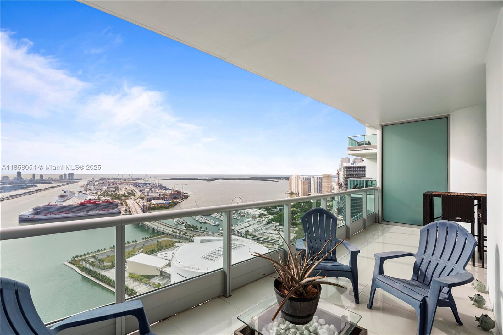 Experience breathtaking bay and city views from this exceptional residence in one of Biscayne Boulevard’s most iconic and uniquely designed buildings. This spacious 2-bedroom+enclosed den (with closet) offers 3 full bathrooms and an expansive layout with soaring 10-foot floor-to-ceiling windows that flood the space with natural light. Enjoy seamless indoor-outdoor living with 2 oversized terraces offering both East and West exposures. The Italian-designed kitchen is equipped with premium Sub-Zero and Miele appliances. Indulge in resort-style amenities including temperature-controlled pools, a full-service spa with jacuzzi, sauna, steam room, locker rooms, a state-of-the-art fitness center, and an in-house movie theater. In the heart of Miami’s cultural and entertainment corridor.