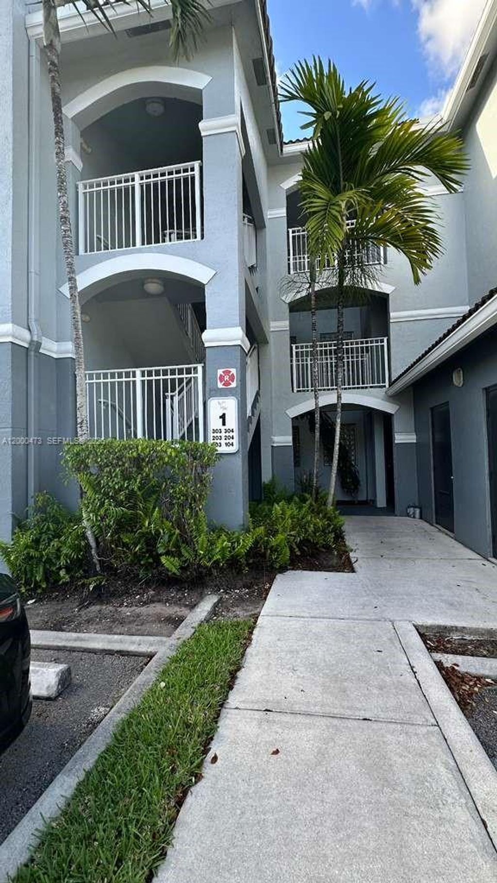 Photo of 9645 NW 1st Ct #1-303, Pembroke Pines, FL 33024 (MLS # A12000473)