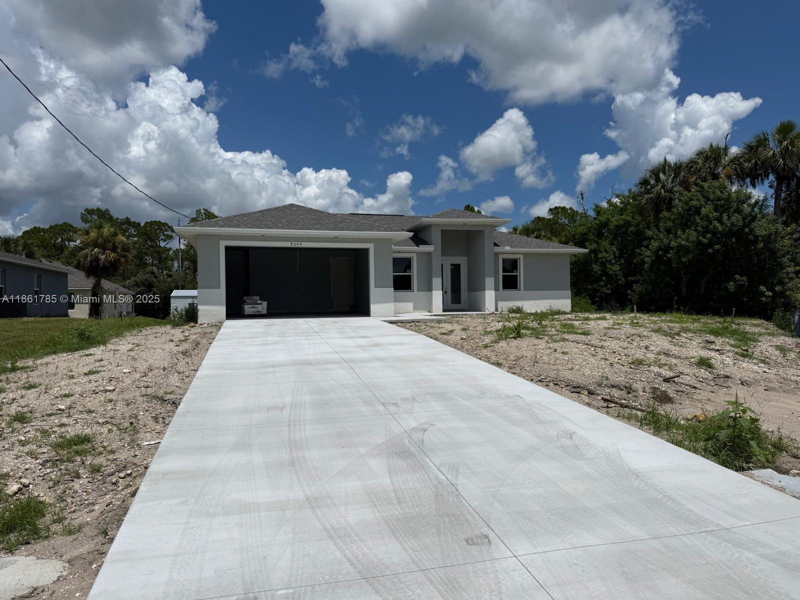 Beautiful new construction 4 BEDROOMS, 2 BATHROOMS to be completed by October 2025 . This home has a modern design including many features: Double glass door, tray ceilings, impact resistant doors and windows, all tile floors, floor to ceiling tiled master shower, 8' interior doors, 9' 4 ceiling height, stainless steel appliances, granite level 2, large size charming island, soft close cabinets, chandelier above dining room, his & her walk in closets in master bathroom, a large size master shower, double sinks in master bathroom, automatic garage door opener, ceiling fans in bedrooms and great room, irrigation system, gutters in front, laundry room with a tub near garage, large size lanai under trusses. A FREE 10 YEAR HOME WARRANTY!! (The fourth bedroom is a large office)