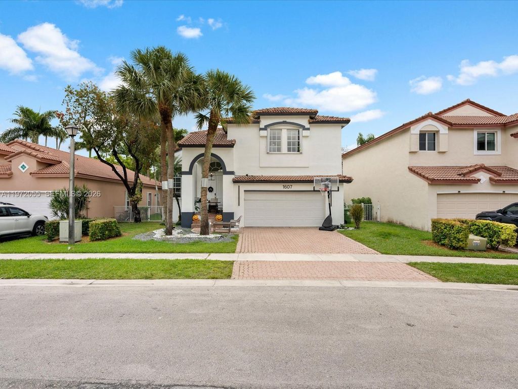 Photo of 1607 SW 157th Ave, Pembroke Pines, FL 33027 (MLS # A11972055)