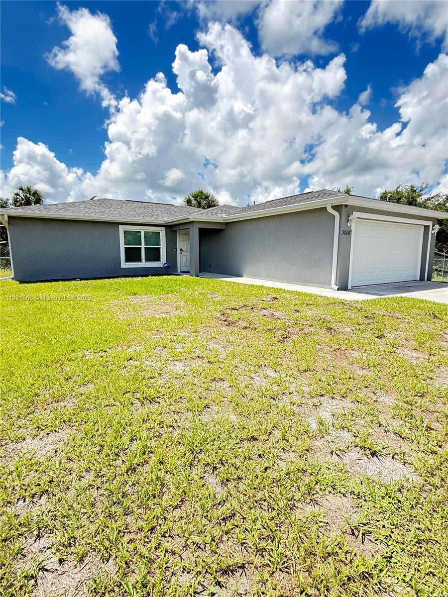 Beautiful home in Labelle! $318K. 3/2, 1364 sq ft. Double garage, fenced yard, ceramic tile floors and baths, appliances included. Outdoor lighting and no neighbors in the back! Ready to move in at 3006 Base Ct! Don't miss it!