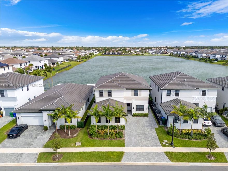 A gorgeous, smart and modern big house with spectacular lake view in a new, and gated community Marbella. Open layout with 10’ ceilings, kitchen with island, SS appliances, quartz countertop and breakfast area, tile throughout the first floor. Guest apartment with kitchenette, laundry and independent entrance. Elegant vinyl flooring on the second floor. Master bedroom with  extra room inside, 2 huge custom walking closets, bathroom with shower & bathtub; 3 secondary bedrooms with custom walking closet, laundry room. Outside, it has a paved & covered terrace, a 7 seats Hot Tub and green patio overlooking the lake, double car garage with a large driveway. Clubhouse with gym and pool.  A grade school, near Memorial Hospital Miramar, Miramar Parkway, I-75 and US-27 .