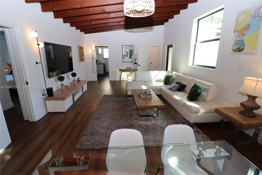 Exceptional mid-century modern home in the heart of Biscayne Park,showcasing dramatic vaulted ceilings,refined architectual lines,& a beautifully curated indoor-outdoor lifestyle.This 3 bd/2ba home features impact doors & windows throughout,bright updated bathrooms,& sun-filled living spaces framed by lush tropical greenery.Expansive grounds offer a private,resort-style setting wth BBQ pavilion,spa,jacuzzi,multiple lounging areas designed for entertaining.Oversized lot room for pool.Fully Airbnb-approved & turnkey.A rare opportunity to own a timeless architectural gem in one of Miami's most coveted neighborhoods.