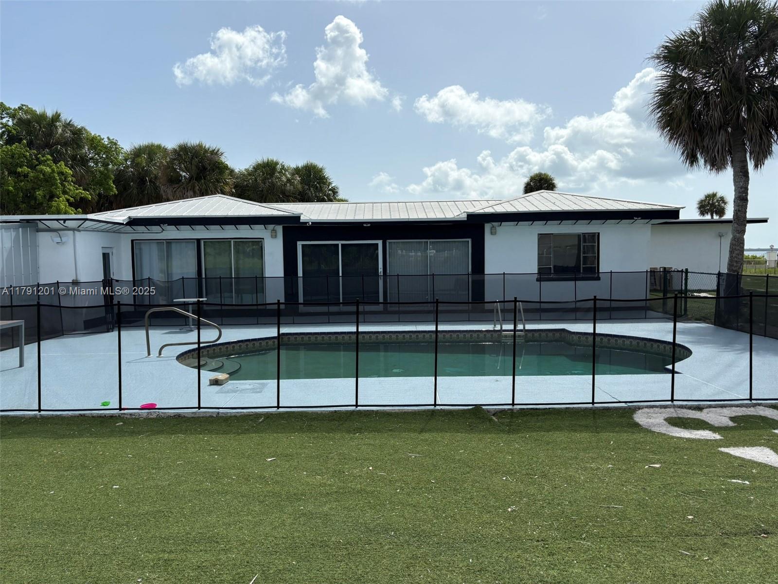 Can be short or long term rental over 3,250 SQFT Riverfront Oasis Home in Fort Pierce. Over 1 Acre Dream waterfront retreat! 3-bedroom, 3-bathroom home easily be converted into a 4-bed. 250 feet of river frontage with breathtaking sunrise views. Nestled on over 1 acre of lush, this property is a rare find. Step inside to discover classic terrazzo floors, spacious living areas, and large windows that bring the outdoors in. Whether you're relaxing by the pool or entertaining with the river as your backdrop, this home delivers the ultimate Florida lifestyle. Minutes from Downtown Fort Pierce with its vibrant restaurants, shops, and events, and only a 15-minute drive to the ocean. The best of coastal living. Enclosed Carport not included but can be added.