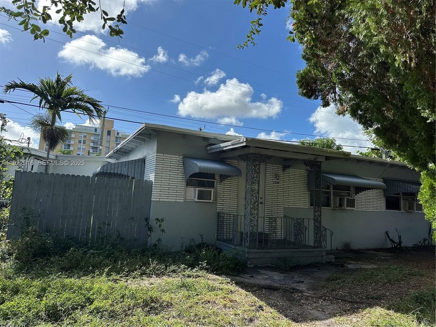 This property is recorded and zoned as a single-family residence. It was originally built with two separate 1/1 sections, each with its own entrance, kitchen, and bathroom, but both sides are connected internally and currently used as one unified home — not legally recognized as a duplex. Located in a great, convenient location within a mixed trailer-park style community, this home offers a uniquely flexible layout for extended family or private living areas within a single-family footprint. Two AC units have been replaced recently, adding comfort and long-term value. A great investment opportunity, but buyers must verify any intended separation, rental use, or modifications with the City of North Miami Beach and Miami-Dade County to ensure compliance with zoning and permitting requirements.