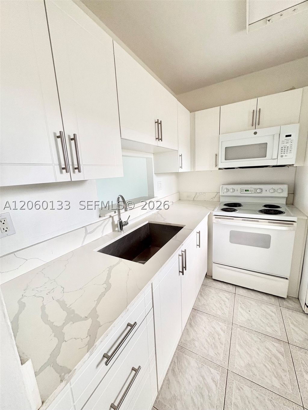 Photo of 5011 W Oakland Park Blvd #310, Lauderdale Lakes, FL 33313 (MLS # A12060133)