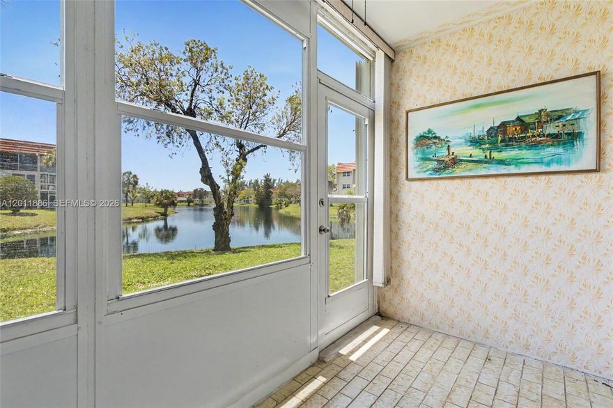Truly stunning waterfront views from this first floor 1/1 in building 12 of Sunrise Lakes Phase I. Gorgeous lake views from the living room and the bedroom - even from the kitchen. The screened in porch with exit door allows you to be lakeside in about 30 steps. Beautiful tile floors and no mirrored walls in the living and dining rooms. Accordion shutters protect the patio. Surprisingly large walk-in closet. Unit is conveniently located across from the laundry room, and your parking space right out front. Unit also comes with extra storage. You really have to see it in person to appreciate these views - it will not disappoint. Community amenities include pool, fitness center, clubhouse, theater, transportation, cable. COA says 55+, no leasing and no pets. 50 year re-certifications have been completed. Some trucks are OK, contact agent to confirm.
