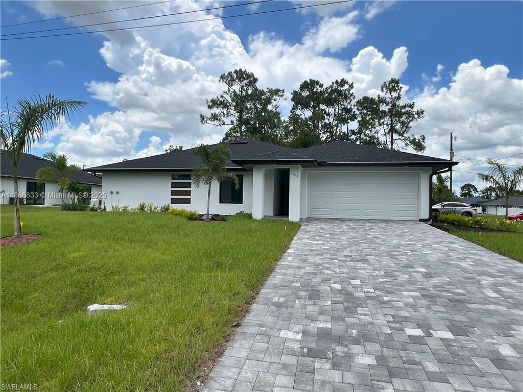 **Annual Rental** Experience modern living in this stunning brand-new duplex in Lehigh Acres, offering 3 spacious bedrooms, 2 elegant bathrooms, and a 2-car garage. Designed for comfort and style, this home features high-end finishes, premium appliances, and impact windows and doors for peace of mind. The open layout is complemented by a large paved driveway, and the convenience of an included washer and dryer. Enjoy hassle-free living with landscaping and water system maintenance included in the rent. Perfectly located near SR 82, top-rated schools, shopping, and dining—this unbeatable location blends style, comfort, and accessibility. A rare rental opportunity you must see—schedule your showing today!