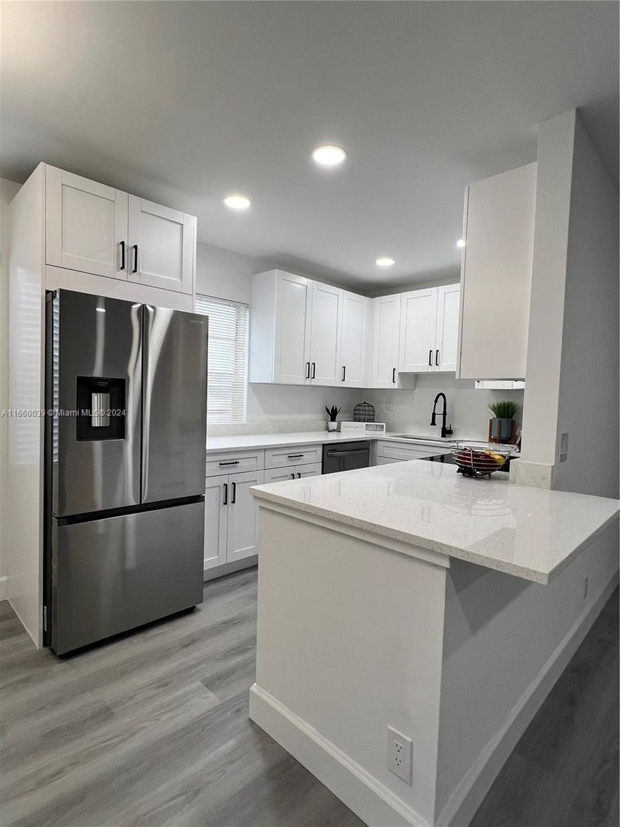 Stunning 2-Bed/2-Bath 2nd Floor with ELEVATOR. Fully update Kings Point 55+ community with private balcony garden view. The unit is welcoming with natural light and smooth-finish ceilings with energy-efficient LED fixtures. The brand-new kitchen is a chef’s dream with an extended quartz countertop with stainless-steel appliances and a modern fridge with easy water access. The open layout makes it perfect for both casual meals and entertainment. Enjoy the convenience of two full bathrooms—one with a relaxing tub and the other with a sleek walk-in shower. Additional perks include an in-unit dedicated laundry room, easy access to an elevator. This condo’s location is privileged in a low-traffic area just a short stroll from the Burgundy Pool & picnic pavilion perfect for outdoor gathering.