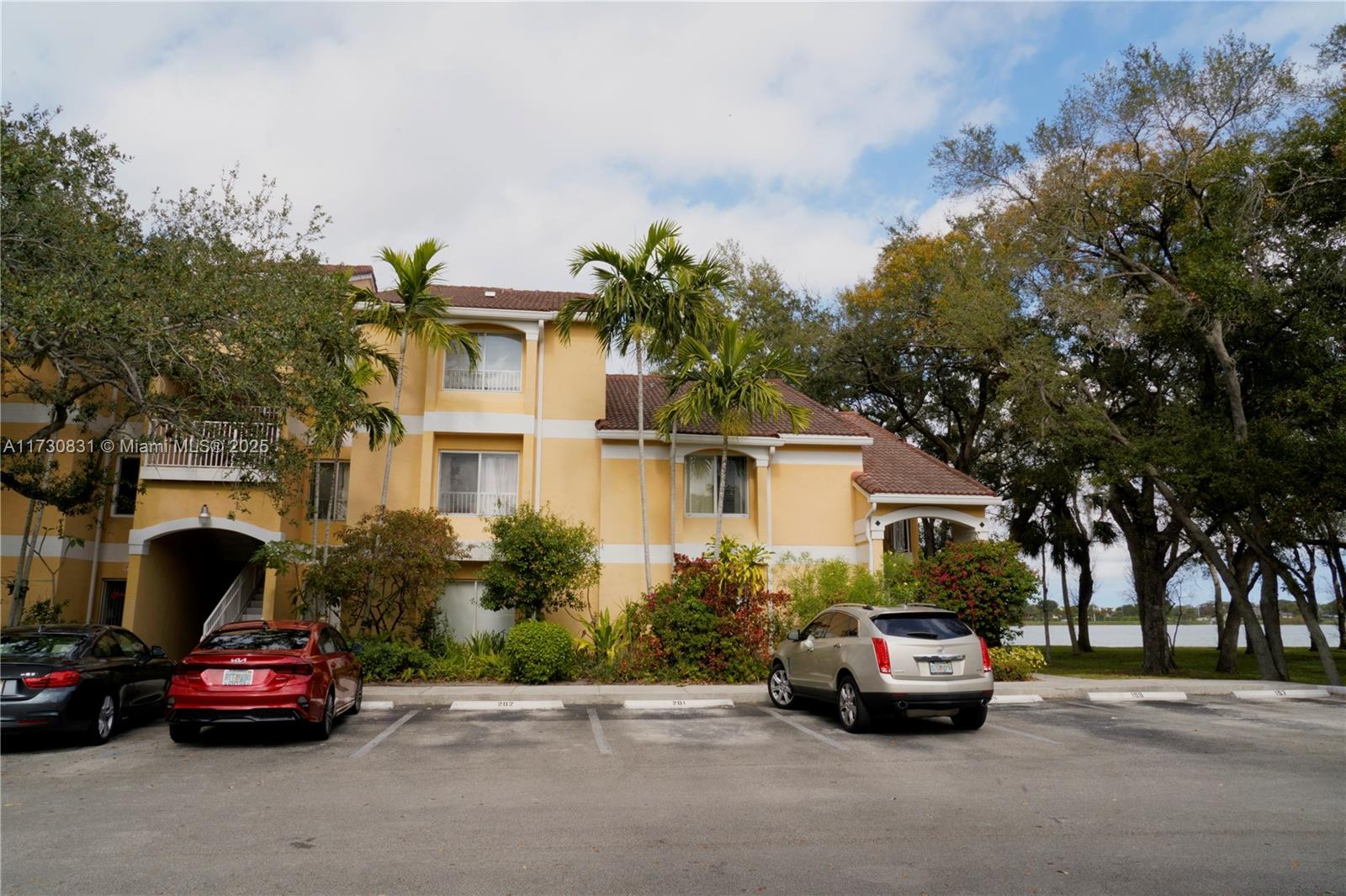 STUNNING LAKEFRONT CONDO with BREATHTAKING VIEW. Welcome to this immaculate, spacious, open-concept condo in South Florida. This beautiful home offers a rare opportunity to enjoy serene lake views from your private, screened-in balcony. Updated interior featuring a modern kitchen with wood cabinets, stainless steel appliances, pantry, and renovated bathrooms. Primary bedroom boasts an en-suite bath and walk in closet. Full-sized washer and dryer inside. Hurricane impact windows. Community amenities include a pool, hot tub, gym, and tennis courts. Take advantage of jogging trails. Explore the vibrant surroundings with shopping, dining, supermarkets, and beaches just minutes away. Major airport nearby. Plenty of guest parking. Don’t miss this opportunity to own a beautiful lakefront condo!