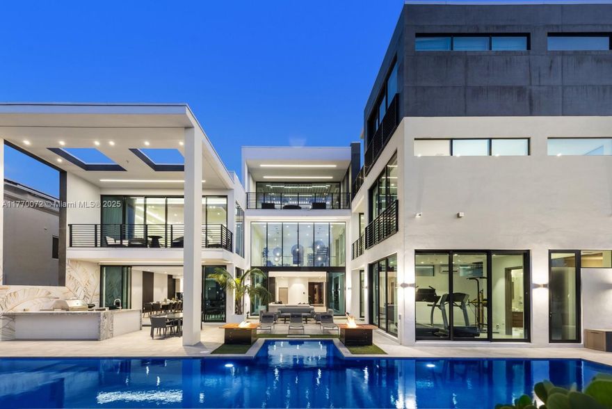 This Captivating luxury South Florida mansion is the ultimate home for a large family or couple who love to entertain. This tri-level modern masterpiece boasts 7 bedrooms, 9 bathrooms, 56ft pool with spa, putting green, half-court basketball, state-of-the-art media room with a bar and pool table. 90ft of waterfrontage completes this offering, perfect for jet skies, or a mid size yacht. Call list agent for exclusive showings.