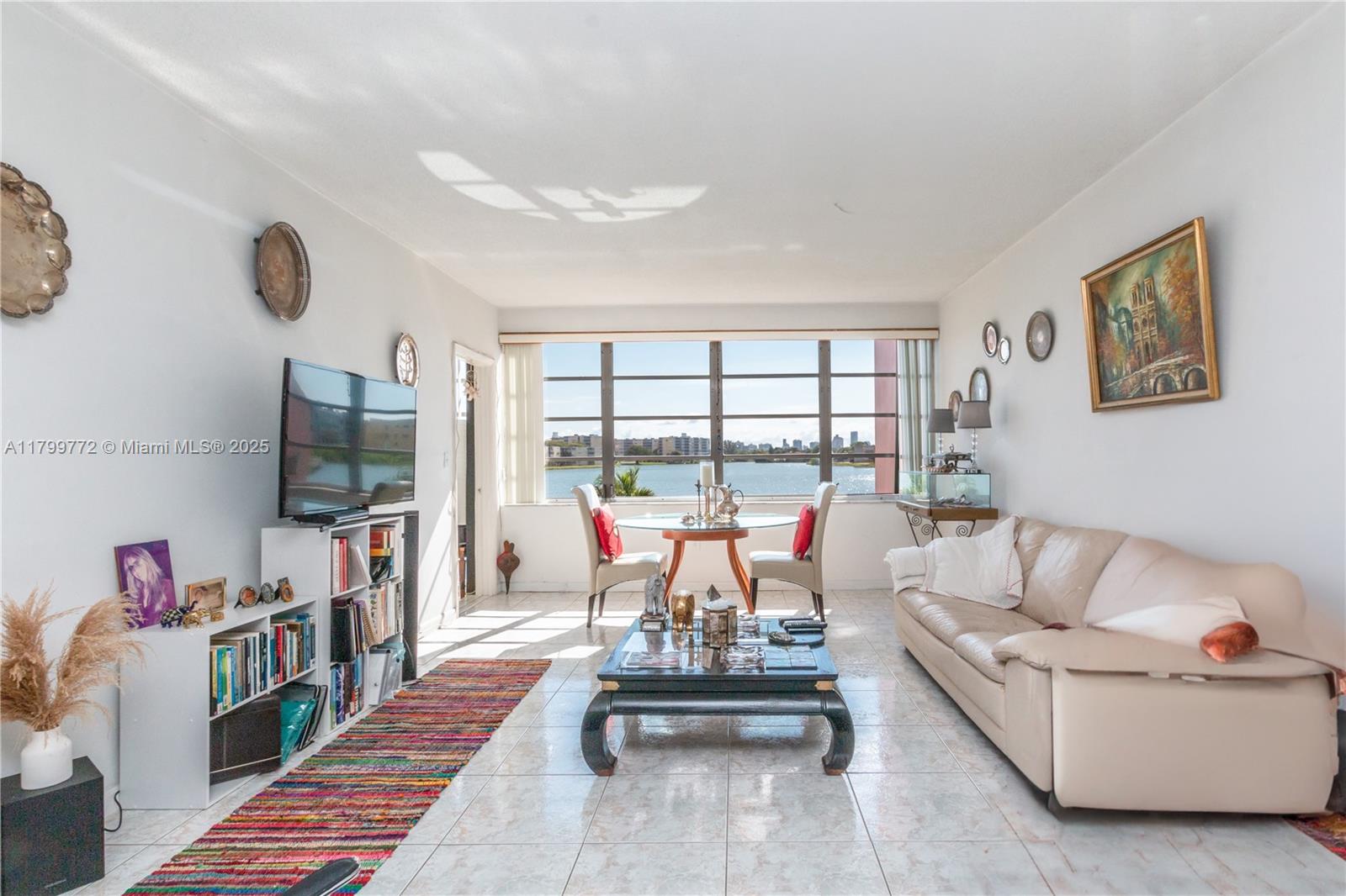 Stunning lake-facing unit in a serene 55+ community! This 1-bed, 1.5-bath gem offers water views from both the bedroom and living room. Features a half-open kitchen, newer fridge, 2022 A/C, and 2020 water heater. 2022 Roof. Located on the second floor with one assigned parking spot. Enjoy resort-style amenities including two lakeside pools, gym, and clubhouse. No rentals or pets allowed—ideal for a first home or peaceful second residence. Prime location: minutes to the expressway, Aventura Mall, Sunny Isles Beach, and steps from Publix, LA Fitness, restaurants, banks, and more!