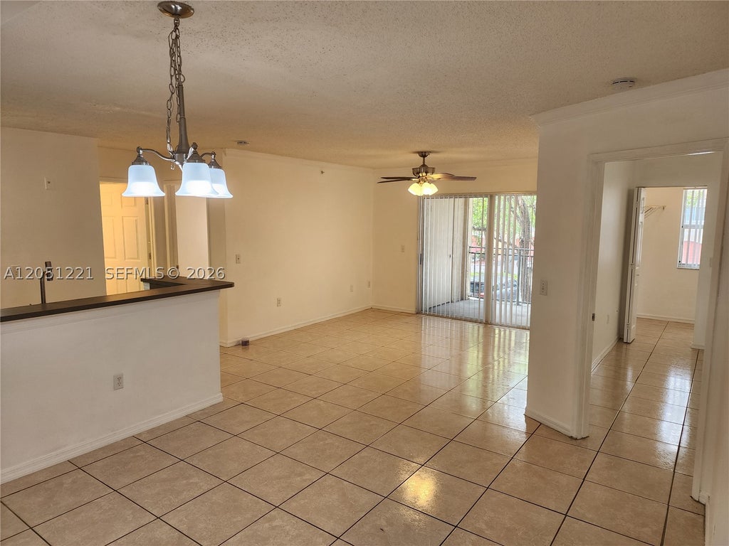Photo of 2433 Centergate Dr #203, Miramar, FL 33025 (MLS # A12051221)
