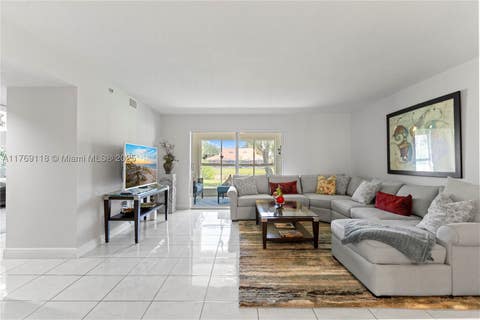 Photo of 5876 Regal Glen Dr #101, Boynton Beach, FL 33437 (MLS # A11769118)