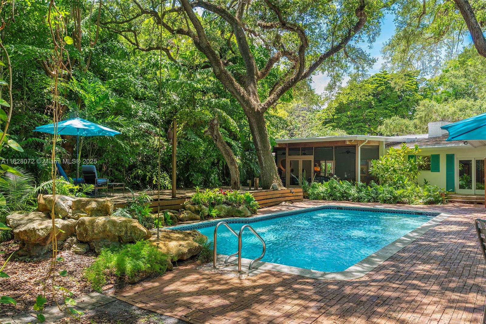 Enchanting Coconut Grove estate offers prestige, security & a coveted address in The Moorings. 24-hr Guard w/ entry by resident consent only. Sub-dividable, Dbl 1/2 Acre lot,16' Elevation, private resident Marina w/ bay access & 3 Parks: Marina, Waterfront & Children's. Walk/Bike to private schools, dining, shops & more. Classic Florida home to a family for 54yrs. Custom-built Mid-Century, hi-ceiling, Open-Concept Living Rm (Fireplace) & Dining Rm is spanned by a Patio seamlessly integrating Pool & large lush yard. Spacious Primary Bedrm w/ His/Hers Walk-in Closets & Baths. 3 En Suite Bedrms, Eat-in Kitchen w/ Stainless counters, Pantry, Storage, Laundry, Workshop & 2-Car Garage. BUILD anew or restore. The opportunity to live in the premier location of The Moorings is rare!