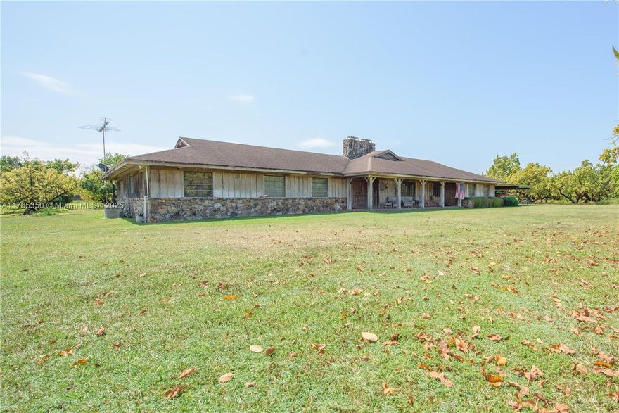 Private farmhouse oasis sitting on 3 Folios = 17+ ac income-producing avocado grove in Redland, FL near fruit & spice park! This custom CBS home, covered in cedar, features a guest/house & offers privacy, & resort-style living. Includes formal living/dining space, spacious kitchen, two fireplaces, & master suite. Four sliding doors open to an 1,860 sq ft screened pool w/ waterfall, sun shelf, & 61x13 patio with bar/grill—great for hosting 100+ guests! Wide porches, 1,335 sq ft carport, & 4,000 sq ft, 20-ft-high tool shed with 1,000 sq ft overhang—ideal for equipment& toys. Property is fully fenced with security cameras onsite. Diesel irrigation & tropical fruit trees: lychee, papaya, banana, carambola, & aloe. Built beyond Miami-Dade code. Zoned to build 2 more homes.