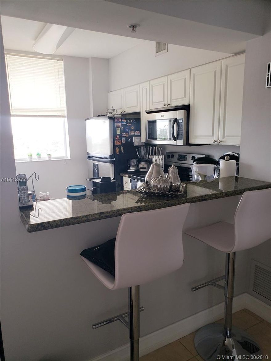 Live in a luxury building with concierge 24/7, exercise room and terrace. Unit has an updated kitchen with stainless steel appliances, porcelain and vinyl tile flooring, washer/dryer in unit.  It is conveniently located minutes from Downtown Miami, airport and Coral Gables.