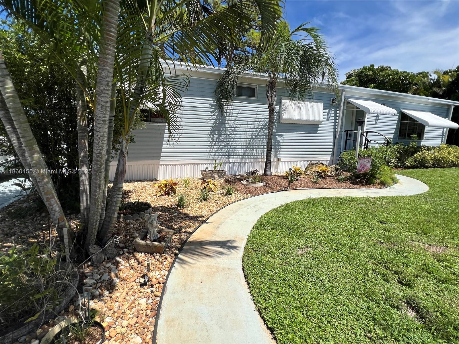 Bring Offers! MOTIVATED SELLER! Home has been kept in excellent condition. Discover your ideal affordable retirement oasis in this 2-bedroom 2bath manufactured home located on a prime spacious corner lot in Gated 55+ community of Jamaica Bay in Boynton Beach. Just off Gateway Blvd & Military Trail - Close to EVERYTHING! No land lease here-just a $250 a month fee - member owned coop eliminating large monthly land and lease fees associated for similar communities. Whether Seasonal or Full time - there is always plenty to do with loads of social opportunities including swimming pools, clubhouse, shuffleboard & bocce courts. All sizes & info approximate, not guaranteed & to be verified by buyer.