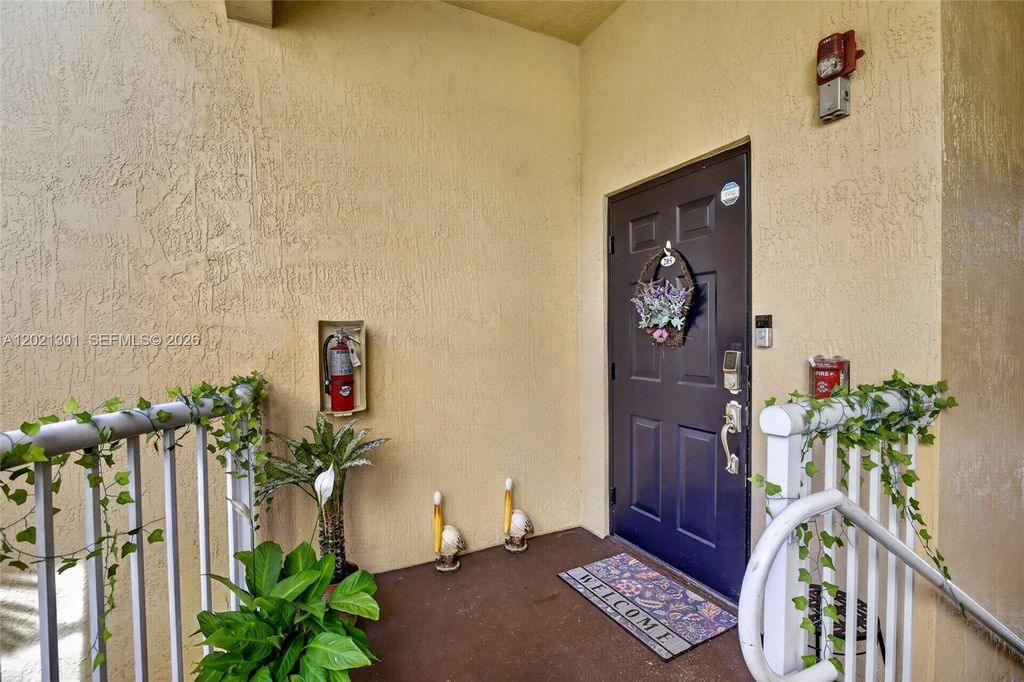 Photo of 120 Jacaranda Country Club Dr #205, Plantation, FL 33324 (MLS # A12021301)