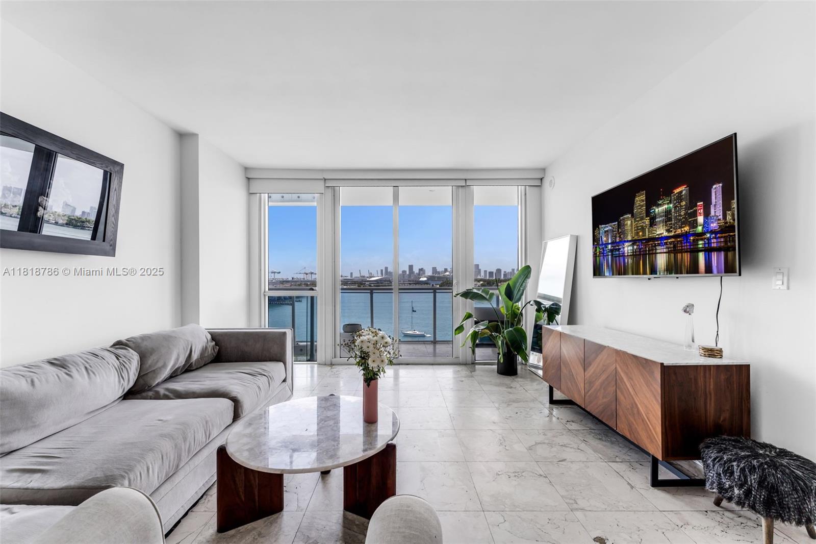 Oversized 1 bed & 1 bath at Bentley Bay with direct bay and Miami skyline views. West-facing unit provides stunning daily sunsets and Star Island views from every room with floor-to-ceiling windows throughout. This bright, open-layout unit features a sleek kitchen, spacious living area and a large master suite. Enjoy resort-style amenities including a bayfront pool, two Jacuzzis, sauna, steam room, gym, 24-hour security and valet. Ideally located just a short walk to the South of Fifth Marina, the beach, and top-tier restaurants. Offered unfurnished and available for immediate move-in.