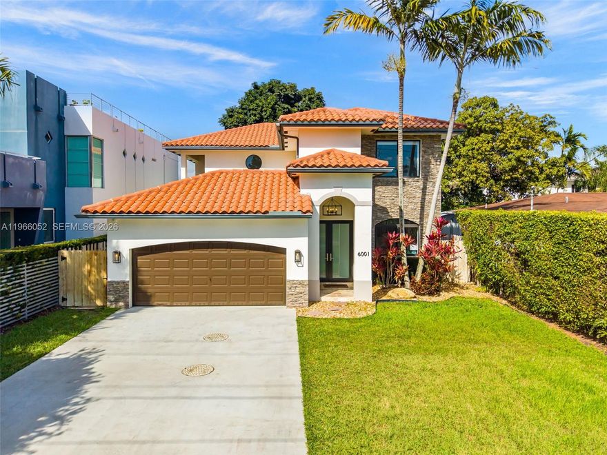A rare opportunity in Schenley Park, just three blocks from Coral Gables, this beautifully appointed residence offers 3,594 square feet of refined living in one of Miami’s most desirable and centrally located neighborhoods. Thoughtfully designed, the home blends an increasingly rare combination of generous scale with effortless functionality.
The layout features four spacious bedrooms, including a convenient downstairs suite ideal for guests or multi-generational living, along with three well-appointed bathrooms. An upstairs den provides flexible space for a home office, media room, or play area. From everyday living to entertaining, the floor plan adapts seamlessly to many buyers’ needs.
Built in 2007 and tastefully updated, the home showcases impact windows, a light-filled kitchen with a clean, modern aesthetic, and stylishly renovated bathrooms. Abundant natural light enhances the interiors, creating a bright and welcoming atmosphere throughout.
Outdoor living at 6001 SW 28th St is equally compelling. An interior courtyard adds architectural charm and privacy, while the covered patio and pool set the stage for relaxed weekends and effortless entertaining. The artificial turf yard ensures year-round greenery with minimal maintenance.
Ideally positioned in the heart of Miami while preserving the quiet residential feel of Schenley Park, the home offers easy access to Coral Gables, nearby parks, dining and shopping, Nicklaus Children’s Hospital, and major thoroughfares.