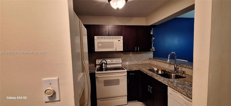 The 40-year repairs are completed and approved, with a new roof and the assessment for this unit fully paid. Water and waste are included, and monthly dues cover all amenities, common areas, the reserve fund, parking, and more. The unit faces north and comes with one assigned parking space.