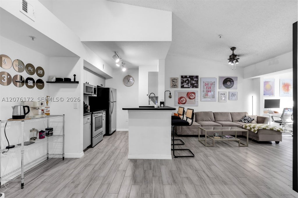 Photo of 2457 Centergate Dr #306, Miramar, FL 33025 (MLS # A12076172)