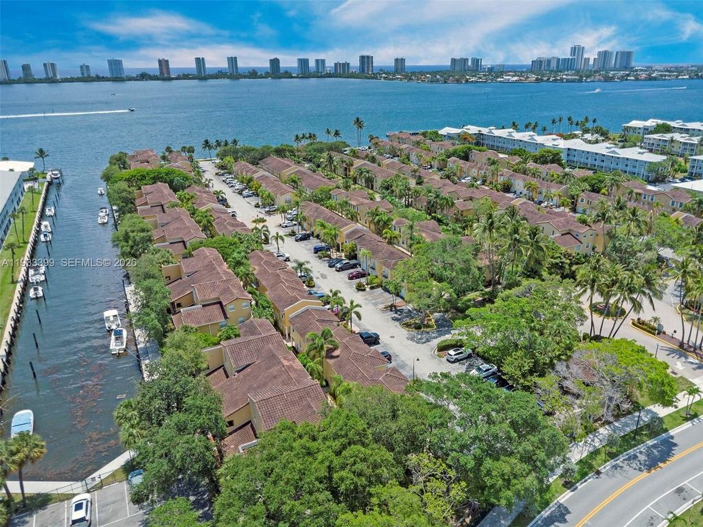 Photo of 1105 Lake Shore Dr #202, Lake Park, FL 33403 (MLS # A11933399)