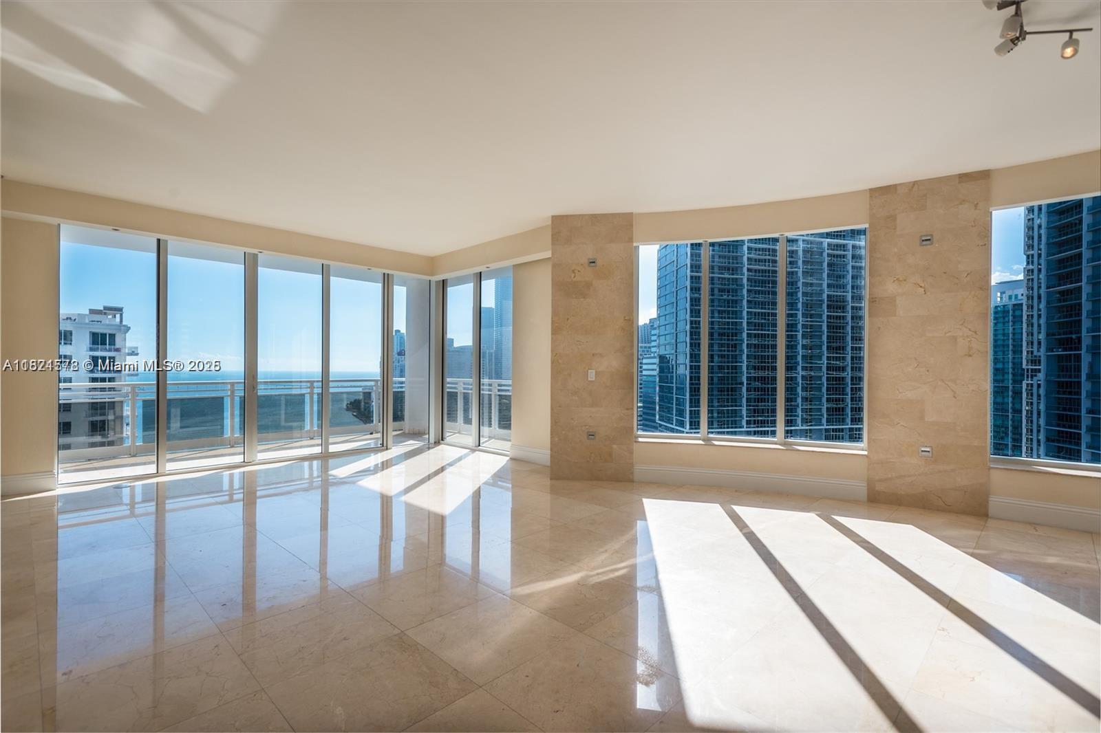 Spectacular 3 bedroom - 3.5 bath corner unit in the desirable 04 line. Spanning 2,591 SqFt with bay and city views. High ceilings throughout w/ 10ft floor-to-ceiling windows. Elegant marble floors and wood
floors, sub-zero stainless steel kitchen appliances, open floor concept and split bedroom plan, floor plan attached.
Excellent amenities: fitness center, heated pool, glass enclosed racquetball, squash, tennis & sauna, kids activities
room, concierge, 24hr security, valet parking and two assigned parking spaces. Easy to show.