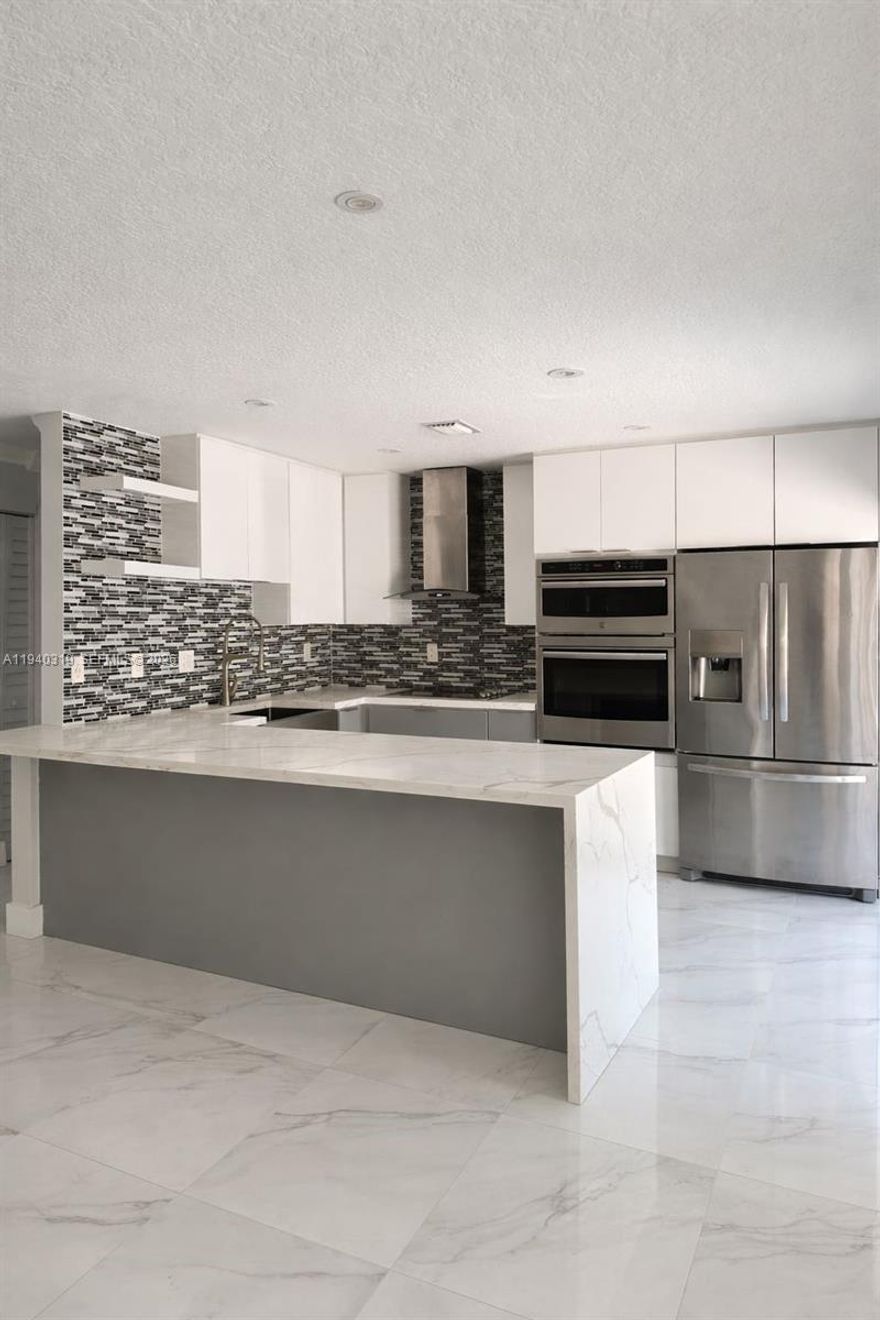 Fully renovated townhome offering modern finishes and move-in-ready convenience. Recent updates include a brand-new kitchen with contemporary cabinetry, countertops, and stainless steel appliances, along with fully updated bathrooms. New flooring, fresh interior paint, and upgraded lighting throughout. Spacious bedrooms with ample closet space and a functional, open layout filled with natural light. Conveniently located near shopping, dining, schools, and major commuter routes. A must-see property. Contact listing agent to arrange showing.