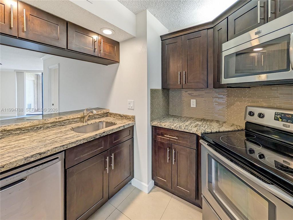 Photo of 10501 W Broward Blvd #408, Plantation, FL 33324 (MLS # A11994788)