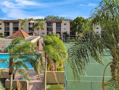 Photo of 10501 W Broward Blvd #408, Plantation, FL 33324 (MLS # A11994788)
