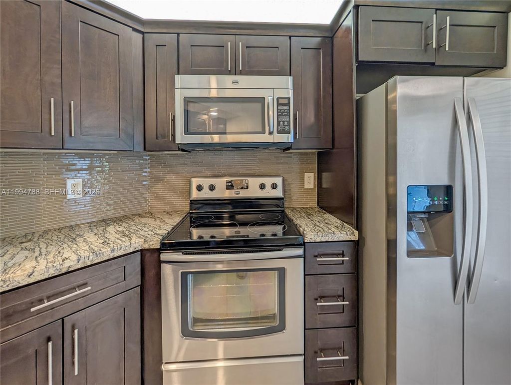 Photo of 10501 W Broward Blvd #408, Plantation, FL 33324 (MLS # A11994788)