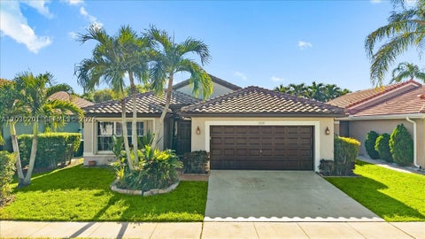 Photo of 2010 NW 182nd Ter, Pembroke Pines, FL 33029 (MLS # A12030201)
