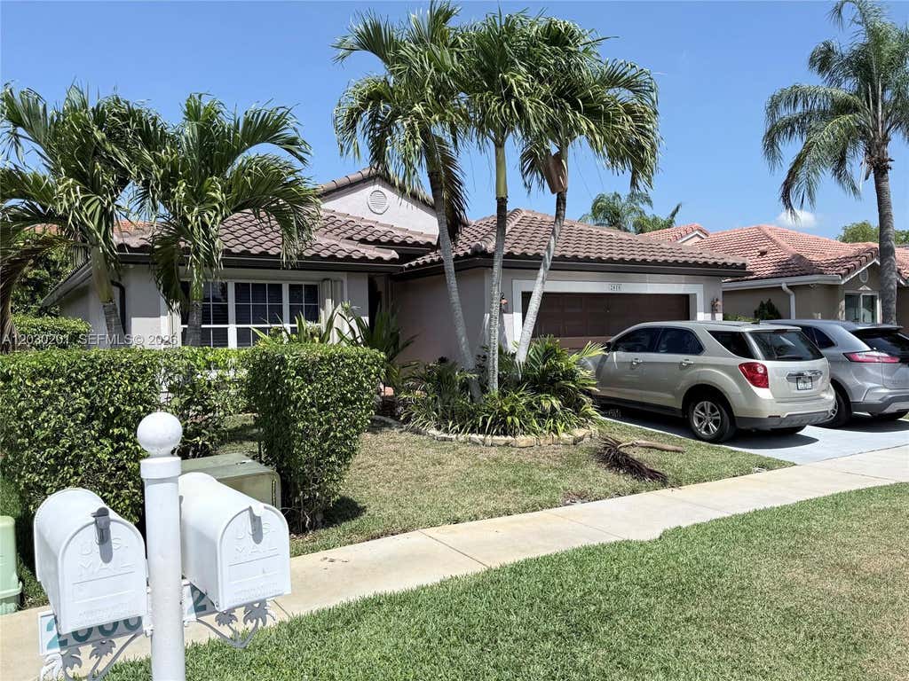 Photo of 2010 NW 182nd Ter, Pembroke Pines, FL 33029 (MLS # A12030201)