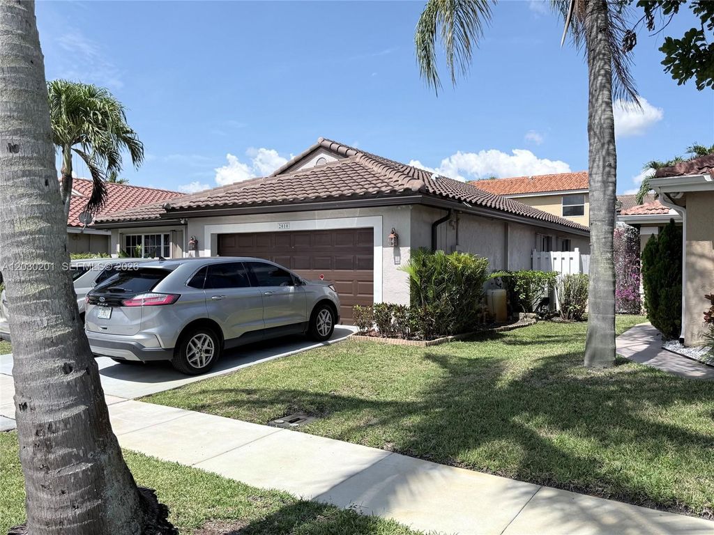 Photo of 2010 NW 182nd Ter, Pembroke Pines, FL 33029 (MLS # A12030201)