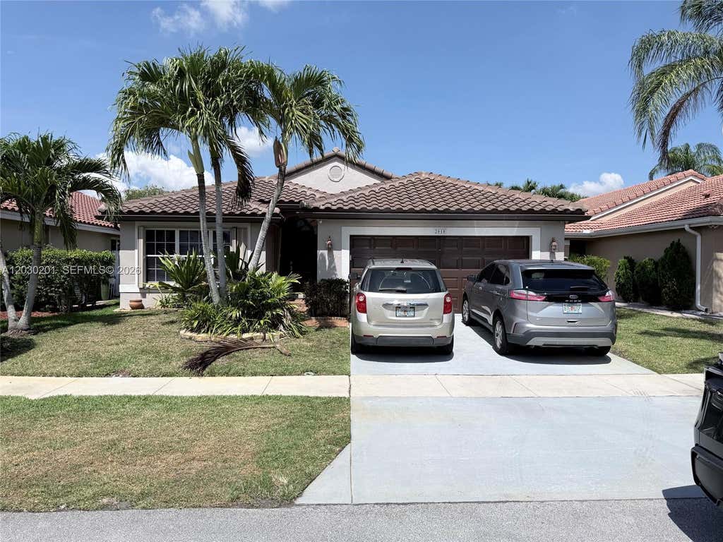 Photo of 2010 NW 182nd Ter, Pembroke Pines, FL 33029 (MLS # A12030201)